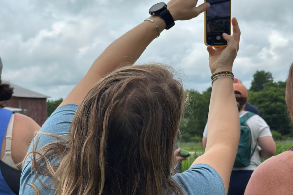 woman recording something on her phone