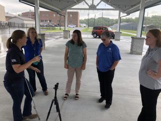 extension agents standing in a circle learning about video production