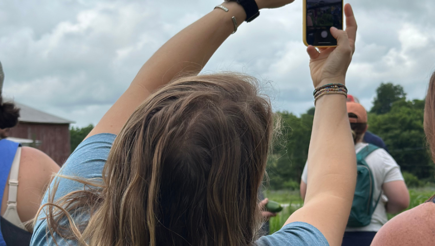 woman recording something on her phone