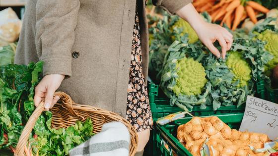 person shopping for produce at market