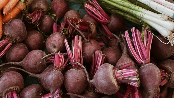 beets, carrots, and onions on a table