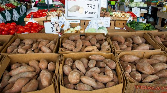 sweetpotatoes in boxes at market