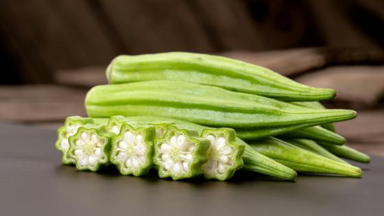 okra whole and cut on table