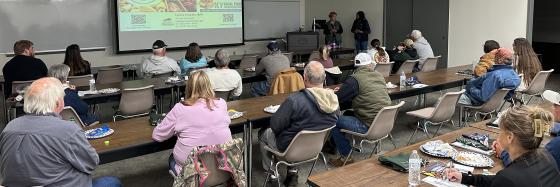 audience seated listening to a speaker